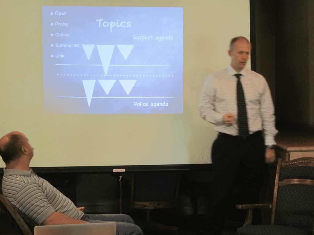 A photo of an IAI instructor presenting a learning material.