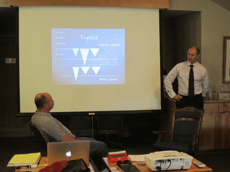 A photo of an IAI instructor presenting a learning material.